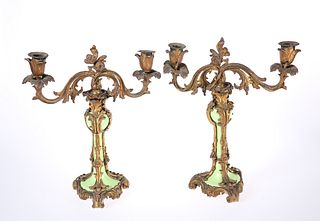 A PAIR OF CONTINENTAL GILT-BRONZE AND PORCELAIN TWIN-LIGHT CANDELABRA, LATE