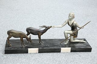 A FRENCH PATINATED SPELTER GROUP, IN THE ART DECO TASTE, the stylised maide
