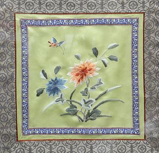 TWO CHINESE SILK EMBROIDERIES, depicting insect and flowers, framed. Larges