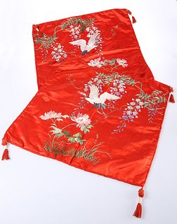 A PAIR OF EARLY 20TH CENTURY CHINESE RED GROUND EMBROIDERED SILK PANELS OR 