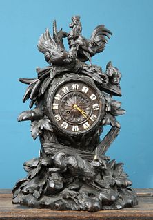 A BLACK FOREST CARVED OAK MANTEL CLOCK, LATE 19th CENTURY, the wooden dial 