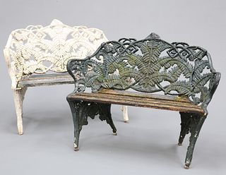 A PAIR OF FERN AND BLACKBERRY PATTERN CAST IRON GARDEN BENCHES, IN THE STYL