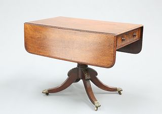 A REGENCY MAHOGANY DROP-LEAF BREAKFAST TABLE, with a frieze drawer opposed 