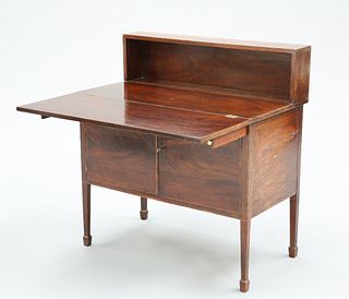 A GEORGIAN MAHOGANY DESK CABINET, with shelf back above a foldover top over