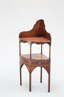 A GEORGE III MAHOGANY BOW-FRONT CORNER WASHSTAND, with two crossbanded draw