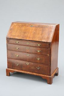 A WALNUT BUREAU, MID 18TH CENTURY, with feather-banded slope opening to rev