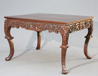 A CHINESE CARVED HARDWOOD TABLE, CIRCA 1900, the square top above a frieze 