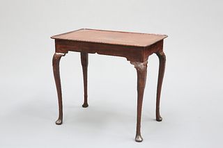 AN 18TH CENTURY IRISH MAHOGANY SILVER TABLE, the dished rectangular top wit
