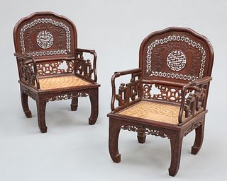 A PAIR OF CHINESE HARDWOOD ARMCHAIRS, with fretwork carved back above a can