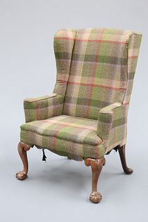 AN 18TH CENTURY WALNUT WING ARMCHAIR, upholstered with tartan cloth, raised