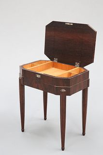 AN ART DECO ROSEWOOD WORK TABLE, of canted rectangular form with quarter-ve