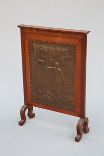 AN ARTS AND CRAFTS OAK AND COPPER FIRESCREEN, CIRCA 1900, with ovolo moulde
