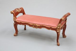 A HANDSOME PARCEL-GILT WINDOW SEAT, IN LOUIS XV STYLE, with out-scrolled le