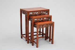 A NEST OF THREE CHINESE HARDWOOD TABLES, each with rectangular panel-moulde