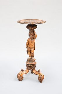 AN ITALIAN CARVED PINE FIGURAL TABLE, the dished carved top supported on a 