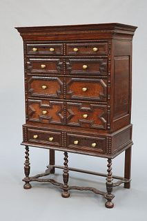 A 17TH CENTURY STYLE OAK CHEST ON STAND, 19TH CENTURY, the upper section wi