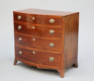 AN EARLY 19TH CENTURY MAHOGANY BOW-FRONT CHEST OF DRAWERS, the string inlai