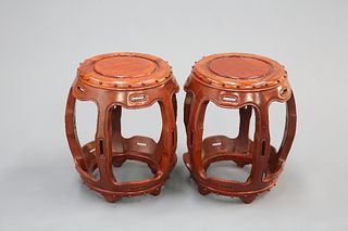 A PAIR OF CHINESE HARDWOOD BARREL SEATS, 20TH CENTURY, the circular tops wi