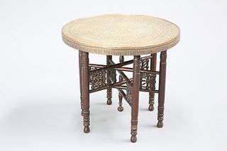 A MOORISH BRASS-TOPPED OCCASIONAL TABLE, EARLY 20TH CENTURY, the circular t