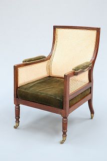 A GEORGE III MAHOGANY LIBRARY BERGERE, with shaped rectangular back and ree