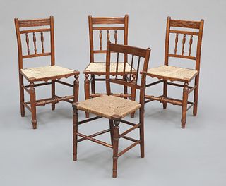 A SET OF THREE RUSH-SEATED  OAK COUNTRY CHAIRS, each with three-spindle bac