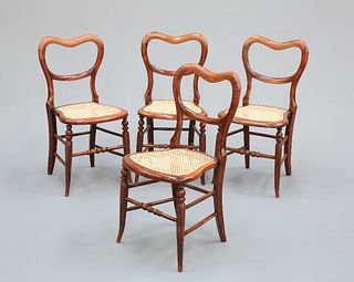 A SET OF FOUR VICTORIAN SIMULATED ROSEWOOD KIDNEY-BACKED CHAIRS, with caned