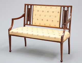 AN EDWARDIAN INLAID MAHOGANY SETTEE, with rectangular upholstered panel to 