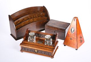 A VICTORIAN OAK DESK STAND, together with A SYSTEM MAELZEL METRONOME, 21.5c
