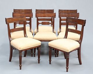 A HARLEQUIN SET OF EIGHT REGENCY MAHOGANY DINING CHAIRS, the bar backs with