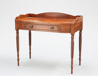 A REGENCY MAHOGANY WASHSTAND, with three-quarter gallery top above a moulde