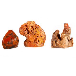Three Chinese stone carvings.