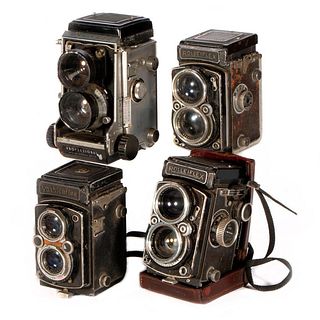 Four vintage cameras.