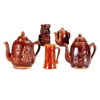 Five pieces of redware pottery.
