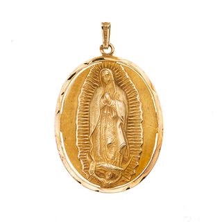 Medalla en oro amarillo de 12k. Imagen de la Virgen de Guadalupe. Peso: 5.4 g.