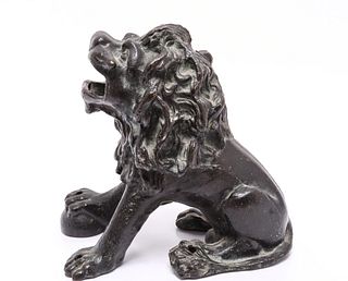 Cast Iron Model Of A Seated Lion
