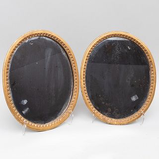 Pair of Small George III Style Oval Giltwood Mirrors