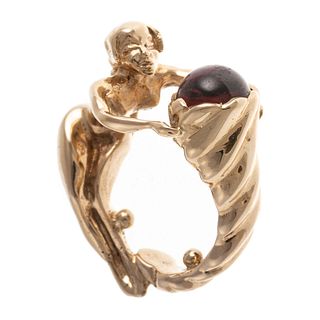 A 14K Ring of Woman Form with Garnet