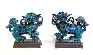 A Pair of Blue Flambe Glaze Foo Dogs.