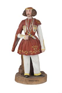A RUSSIAN PORCELAIN FIGURE OF AN IMERETIN MAN, FROM THE "PEOPLES OF RUSSIA" SERIES, GARDNER PORCELAIN FACTORY, MOSCOW, LATE 19TH CENTURY
