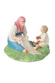 A RUSSIAN PORCELAIN FIGURE OF A PEASANT WOMAN BLEACHING LINEN, GARDNER PORCELAIN FACTORY, MOSCOW, LATE 19TH CENTURY