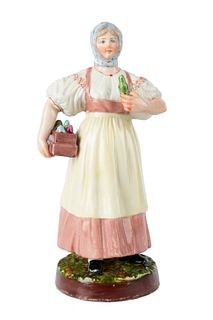 A RUSSIAN PORCELAIN FIGURE OF A PERFUME SELLER, GARDNER PORCELAIN FACTORY, MOSCOW, LATE 19TH CENTURY