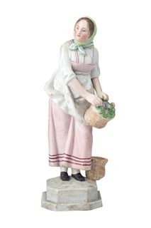 A RUSSIAN PORCELAIN FIGURE OF A FLOWER SELLER, GARDNER PORCELAIN FACTORY, MOSCOW, LATE 19TH CENTURY