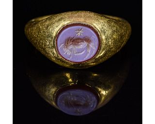 ROMAN GOLD INTAGLIO RING WITH BULL and STAR