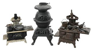Three Miniature Cast Iron Stoves and Accessories