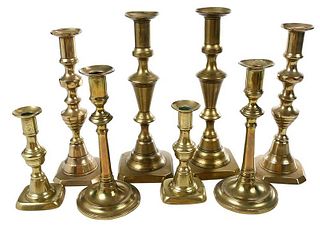 Four Pairs of Brass Candlesticks