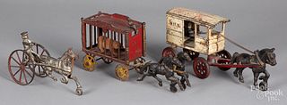 Three cast iron horse drawn wagons