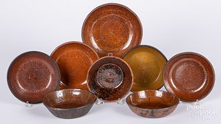 Eight redware shallow bowls, 19th c.