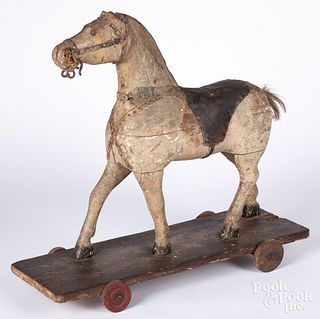 Carved and painted horse pull toy