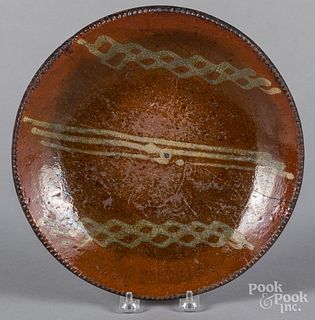 Slip decorated redware plate, 19th c.