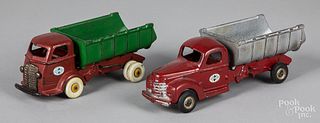 Two Arcade cast iron International dump trucks